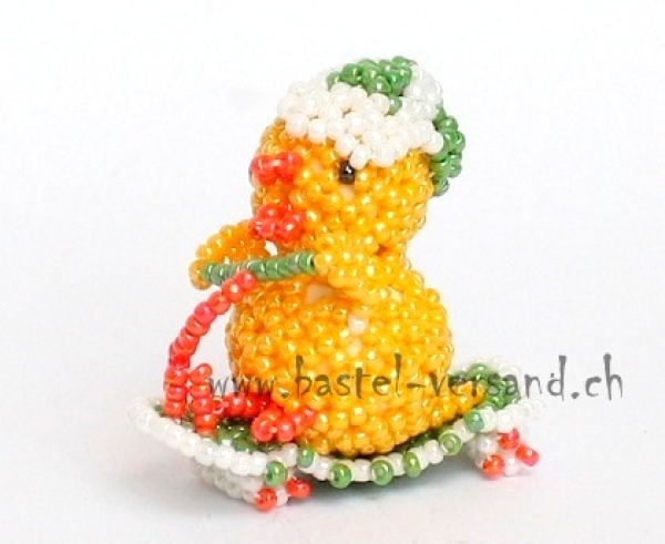 Küken auf Trotti (grün)